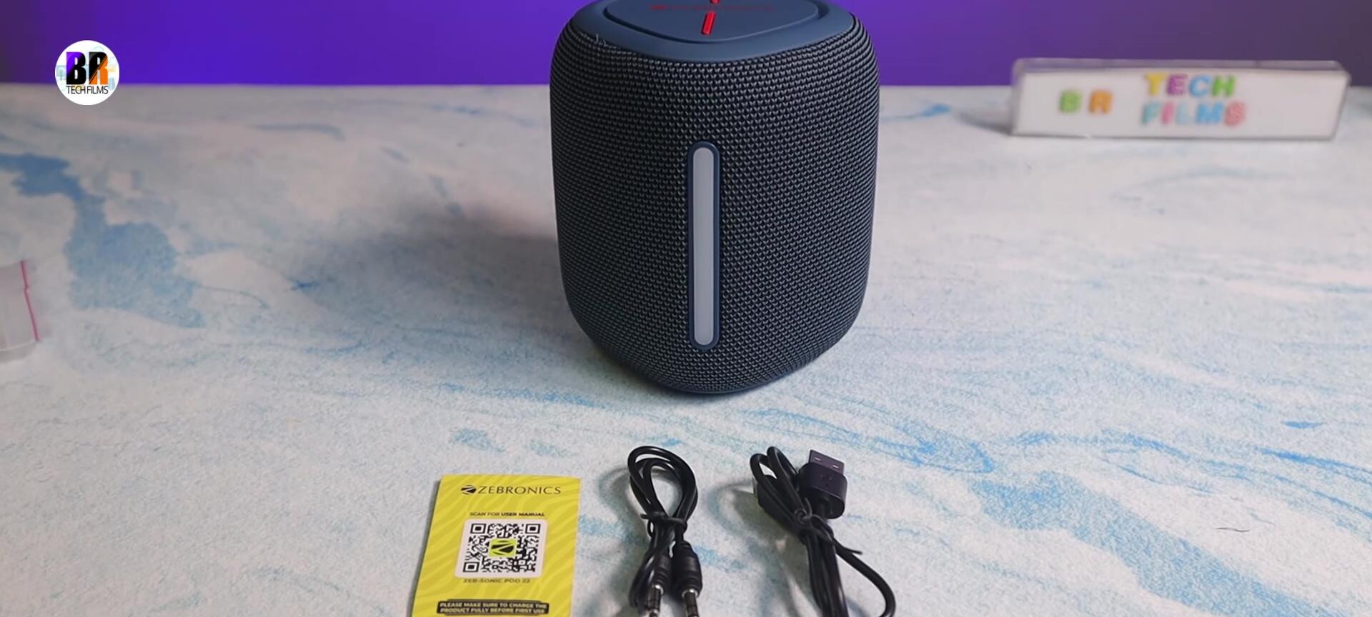 Close-up of the aux cable and charging cable included in the package.