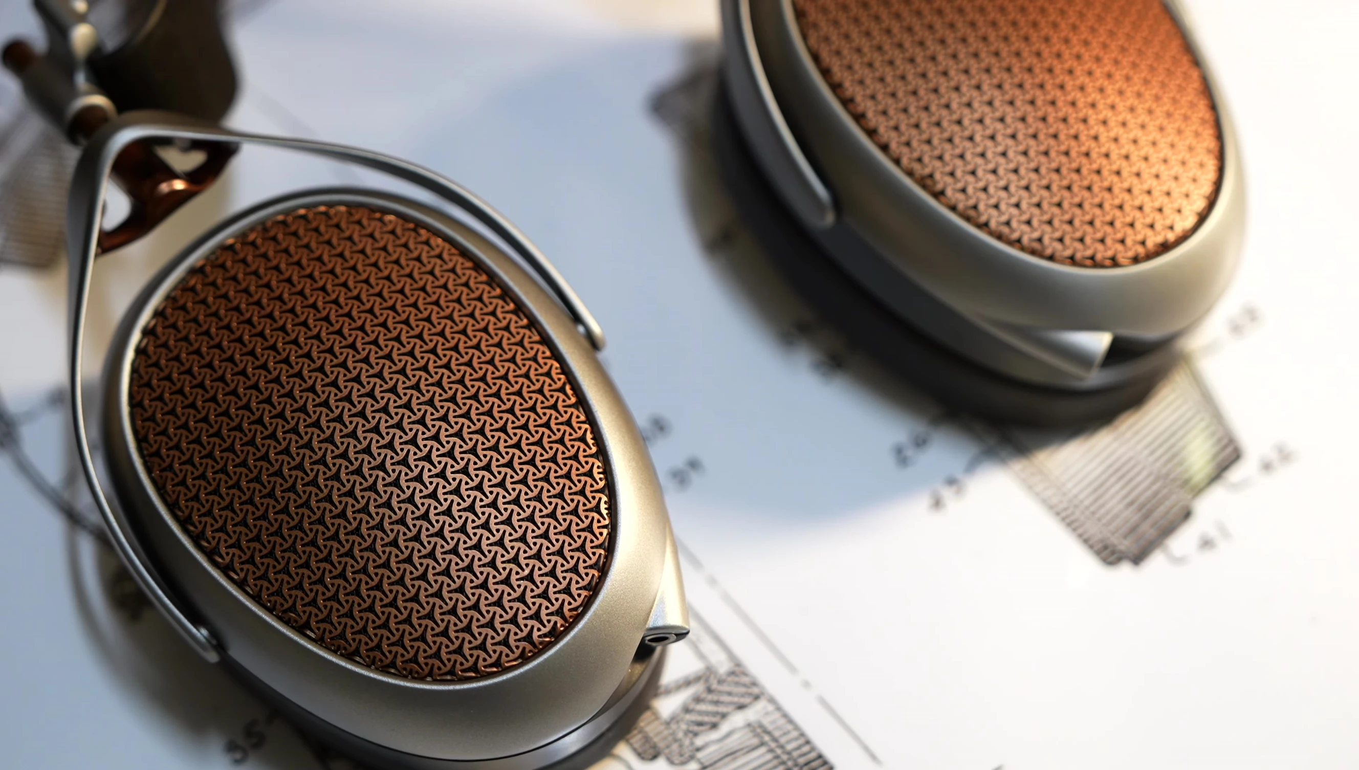 Headphone shown from a side profile to emphasize the size and shape comparison with other Meze models.