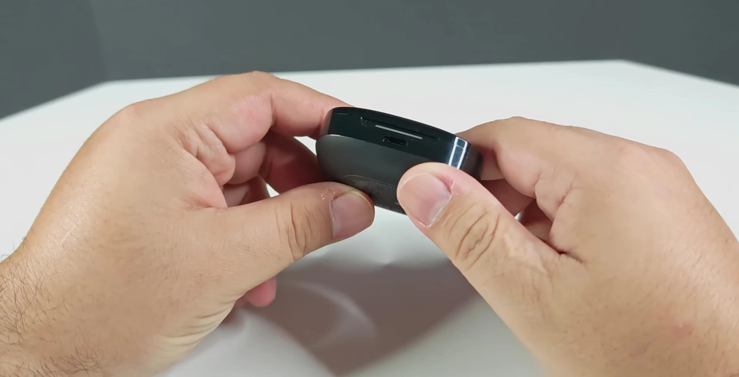 Close-up of the Redmi Buds 6 charging case, showcasing its rectangular shape and matte finish.