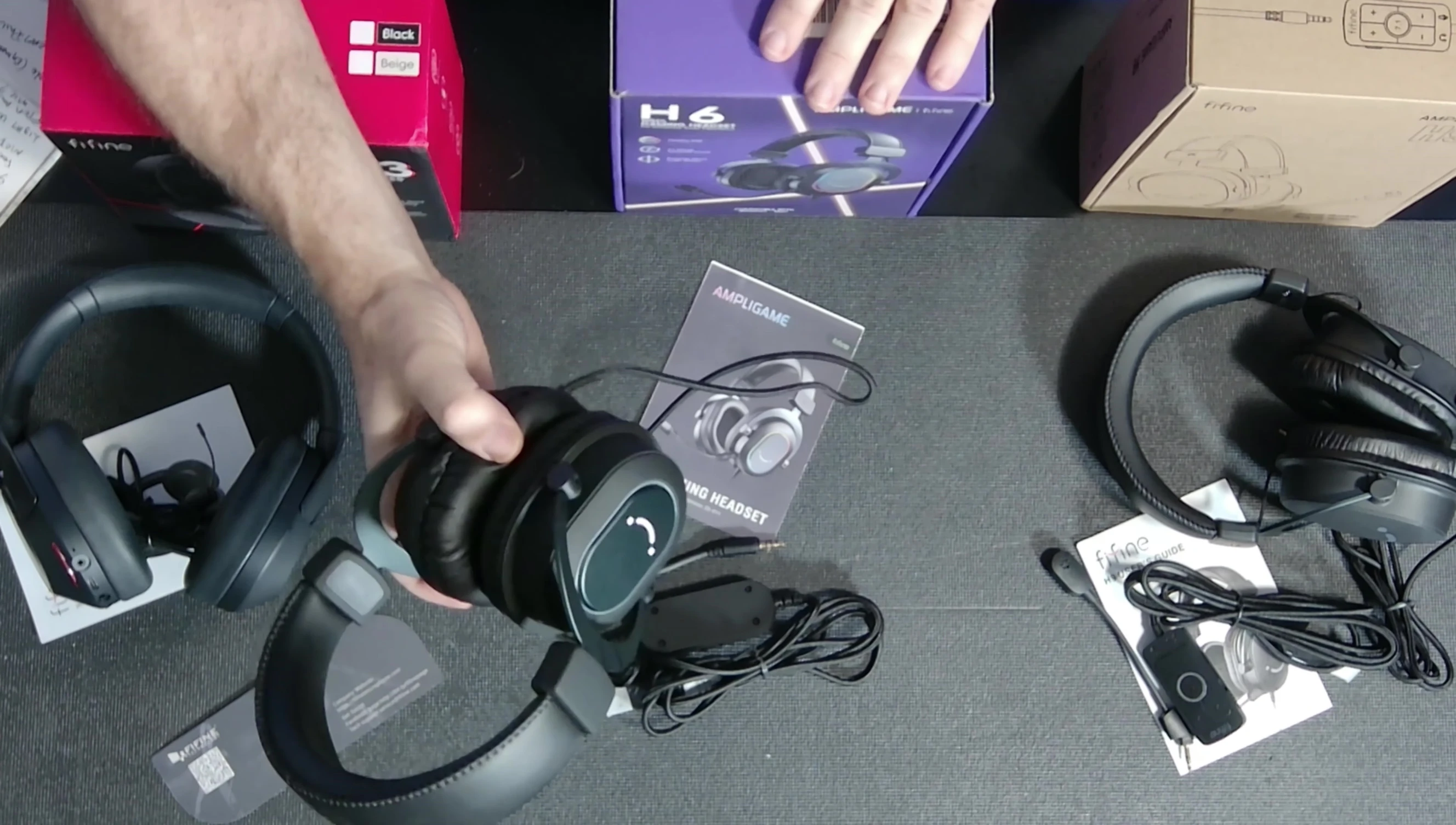 Fifine H6 headset showing equalizer buttons