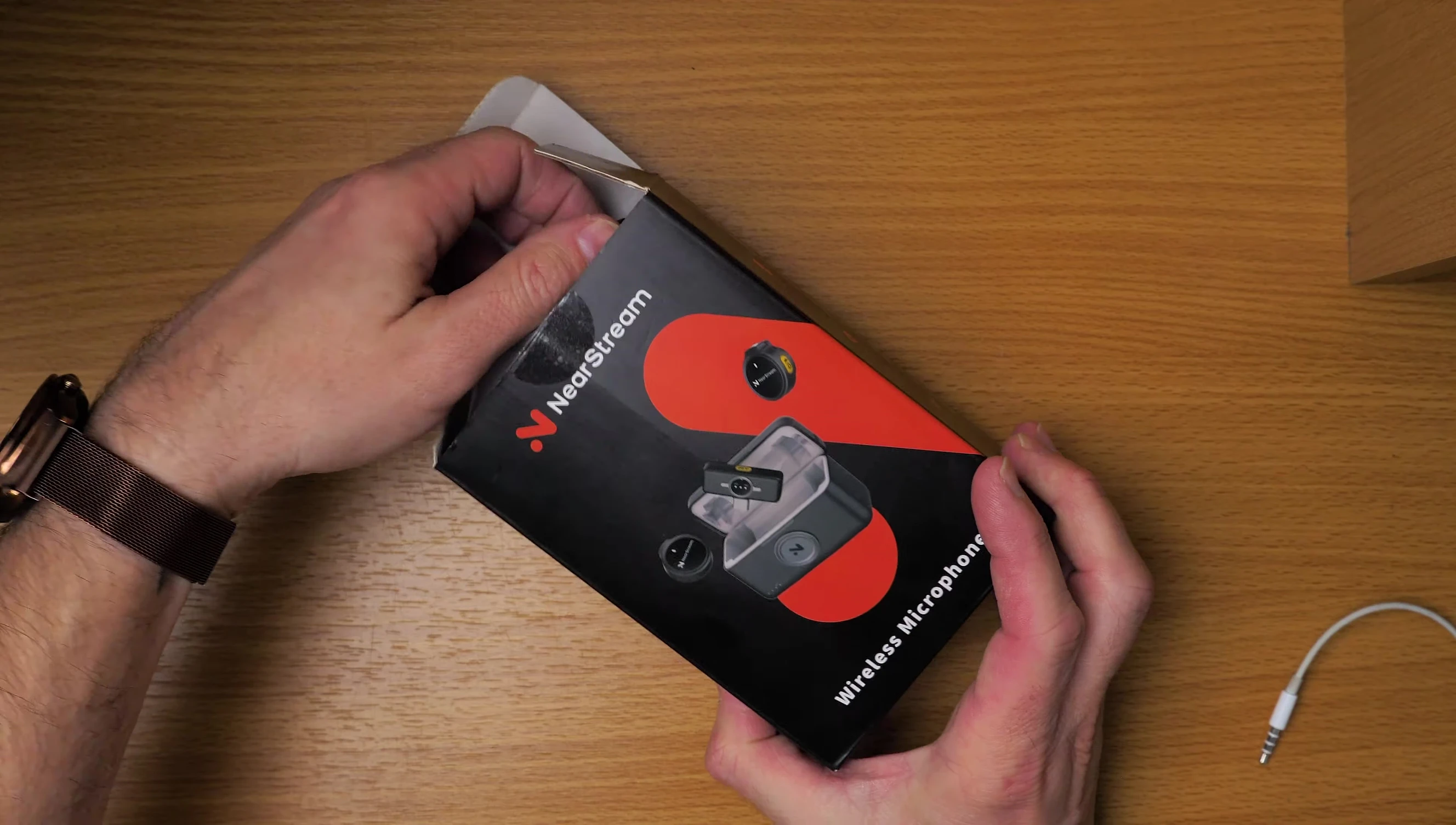 The NearStream AWM25T wireless microphone kit in its fabric carrying case.