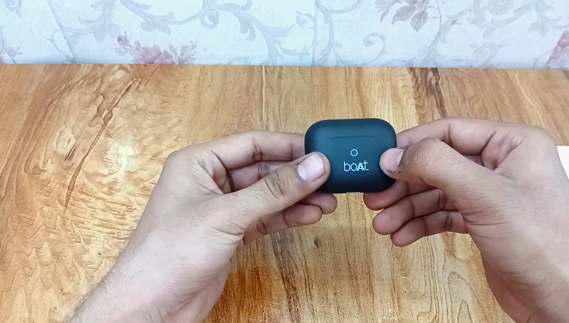 Shot showing the earbuds and their subtle branding.