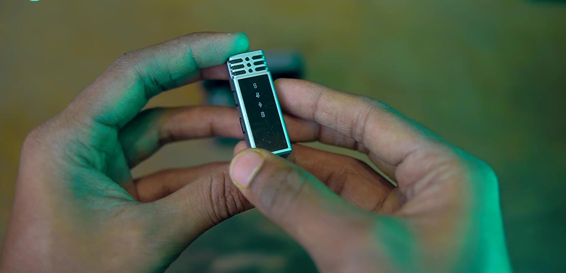 Close-up of the Jmary MW15 transmitter showing LED indicators