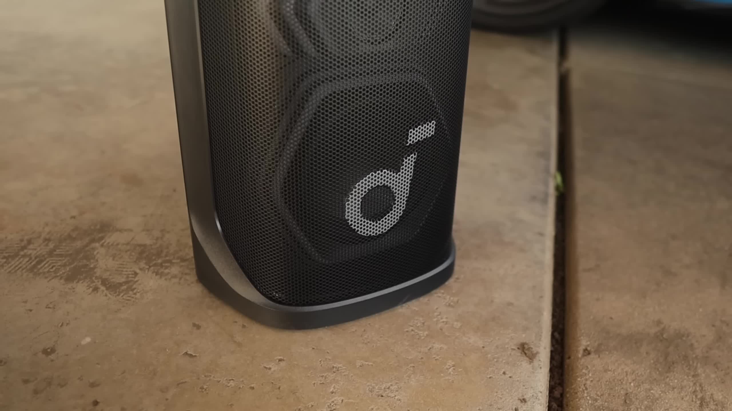 Close-up of the Soundcore Rave 3S showing its robust plastic build and metal mesh grill.