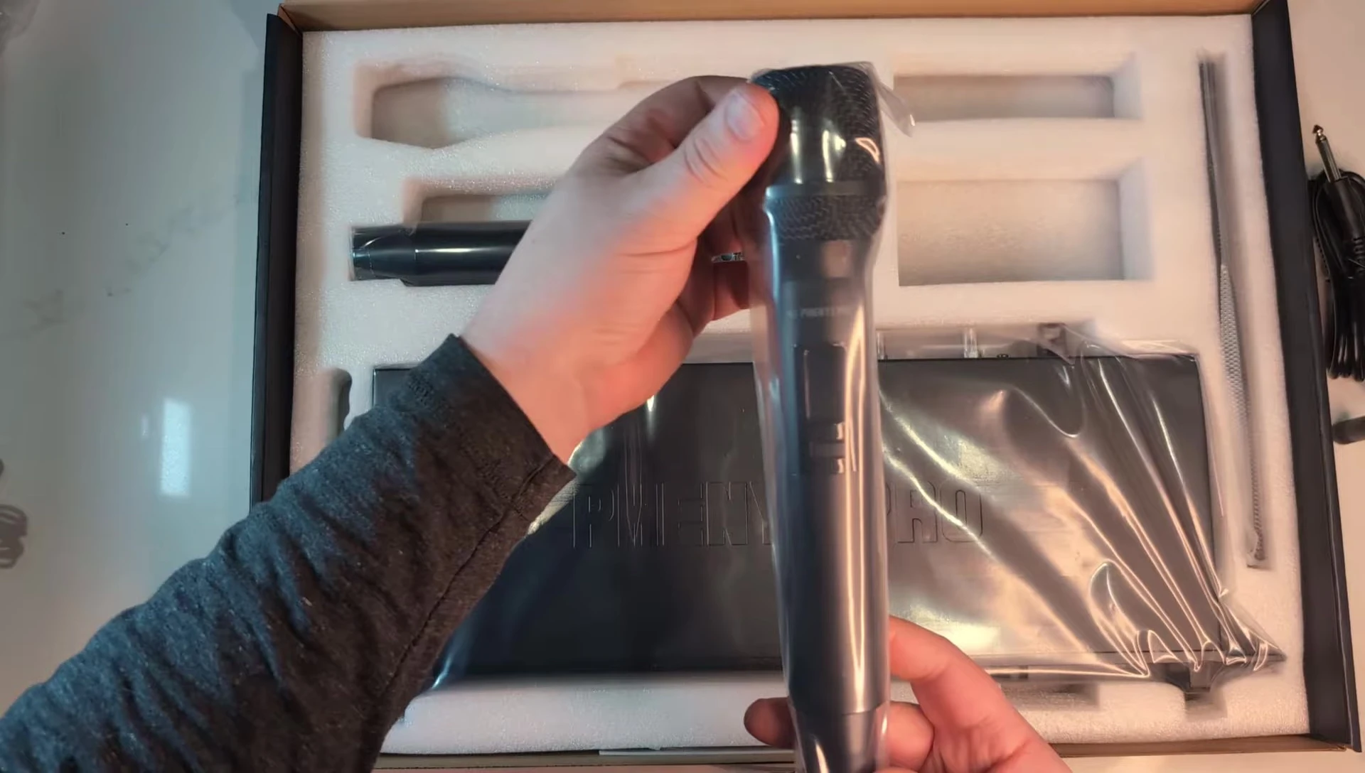 Close-up of one of the microphones, still in its packaging