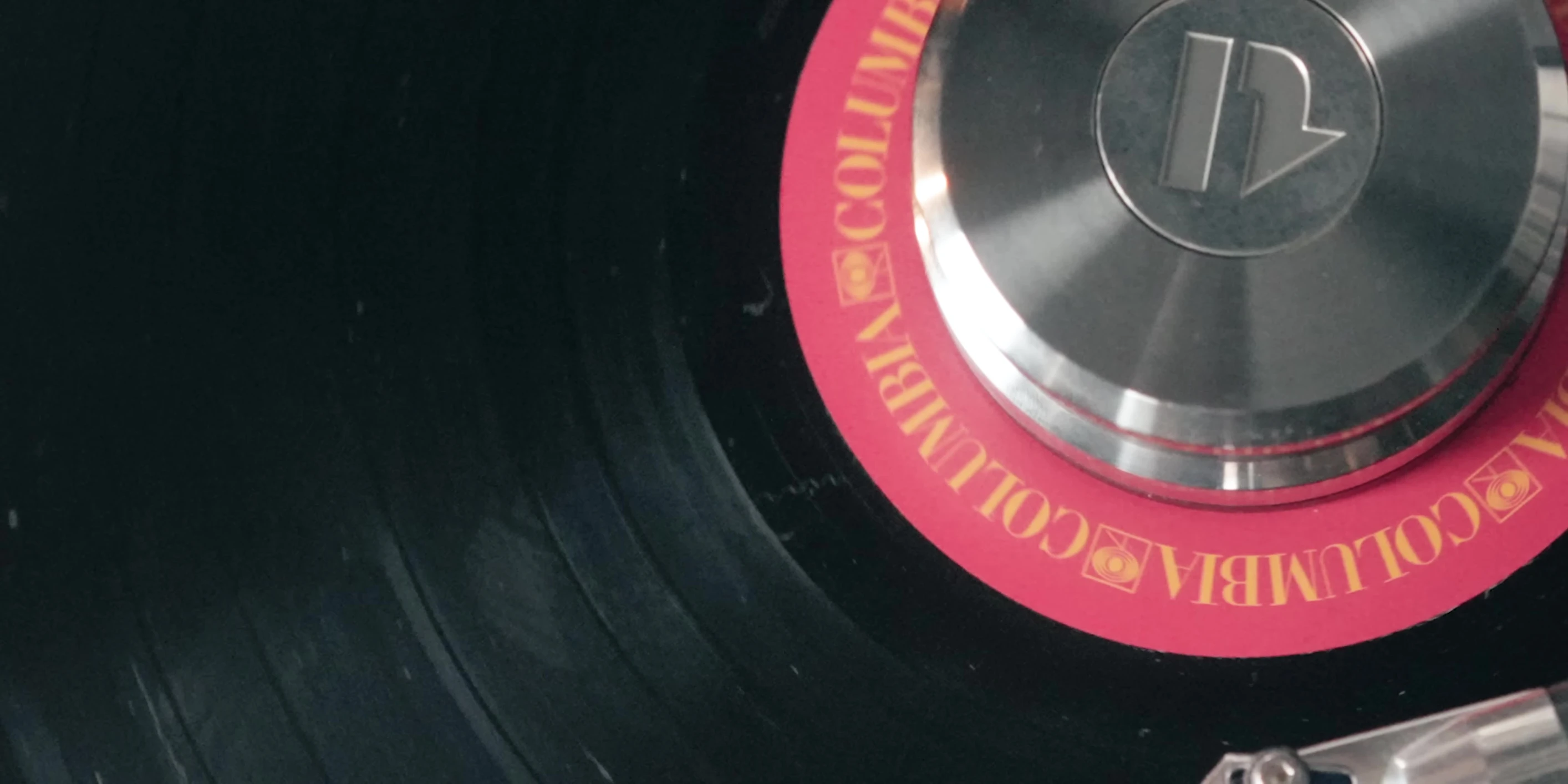 Close-up shot of a record with visible debris.