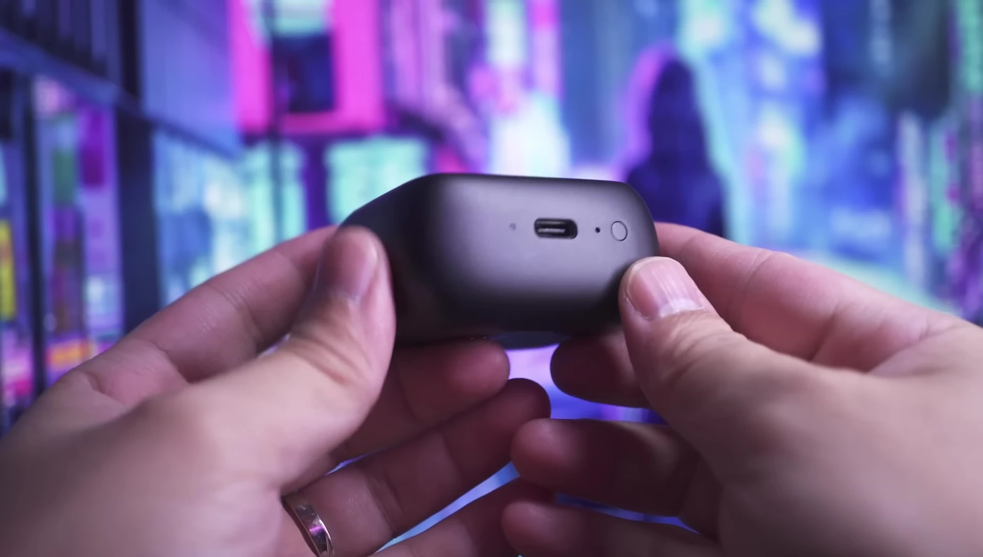 Close-up of the JBL Tour Pro 3 charging case with the touchscreen visible
