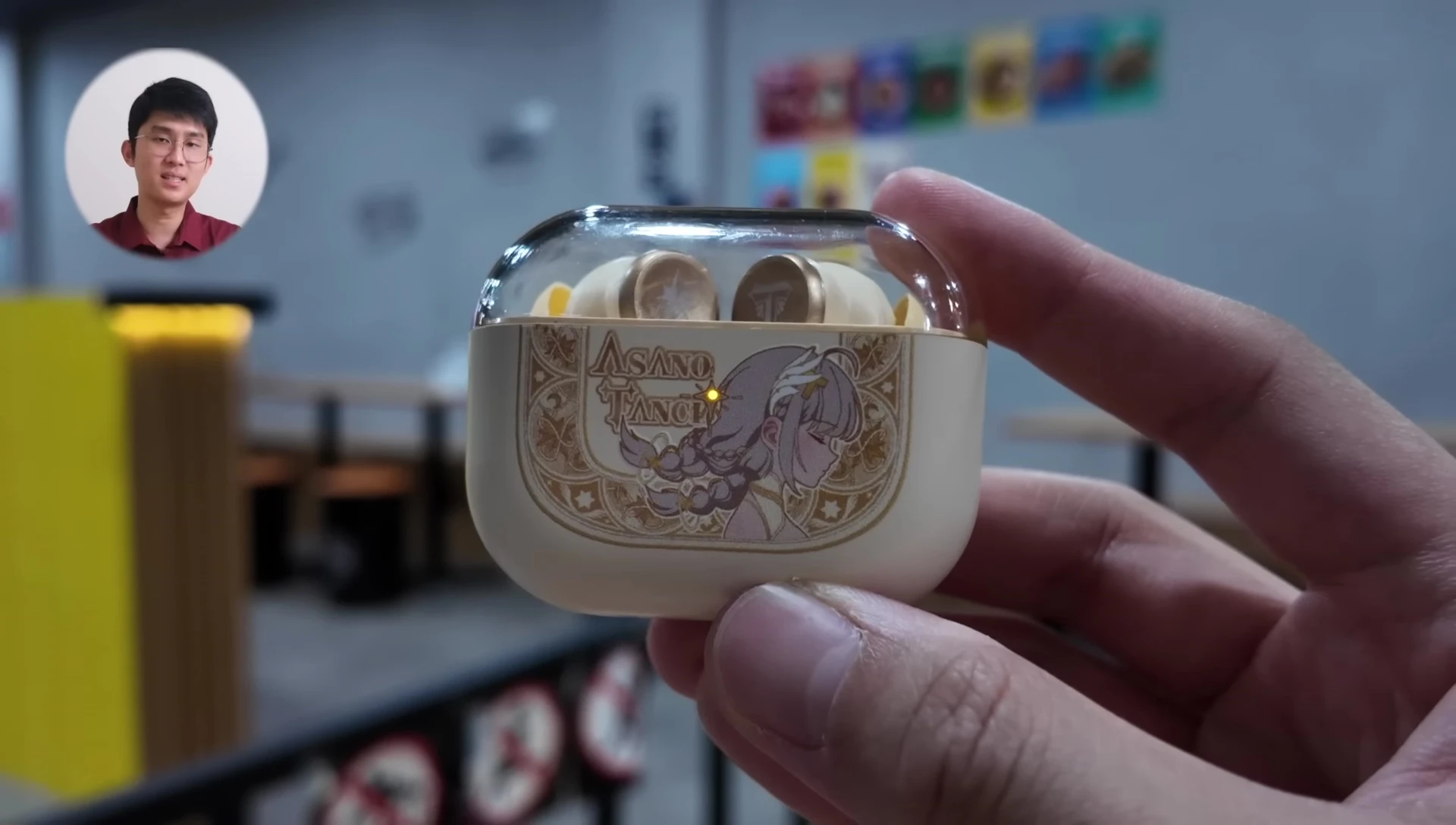 Close-up of the Tanchjim MINO earbuds in their case