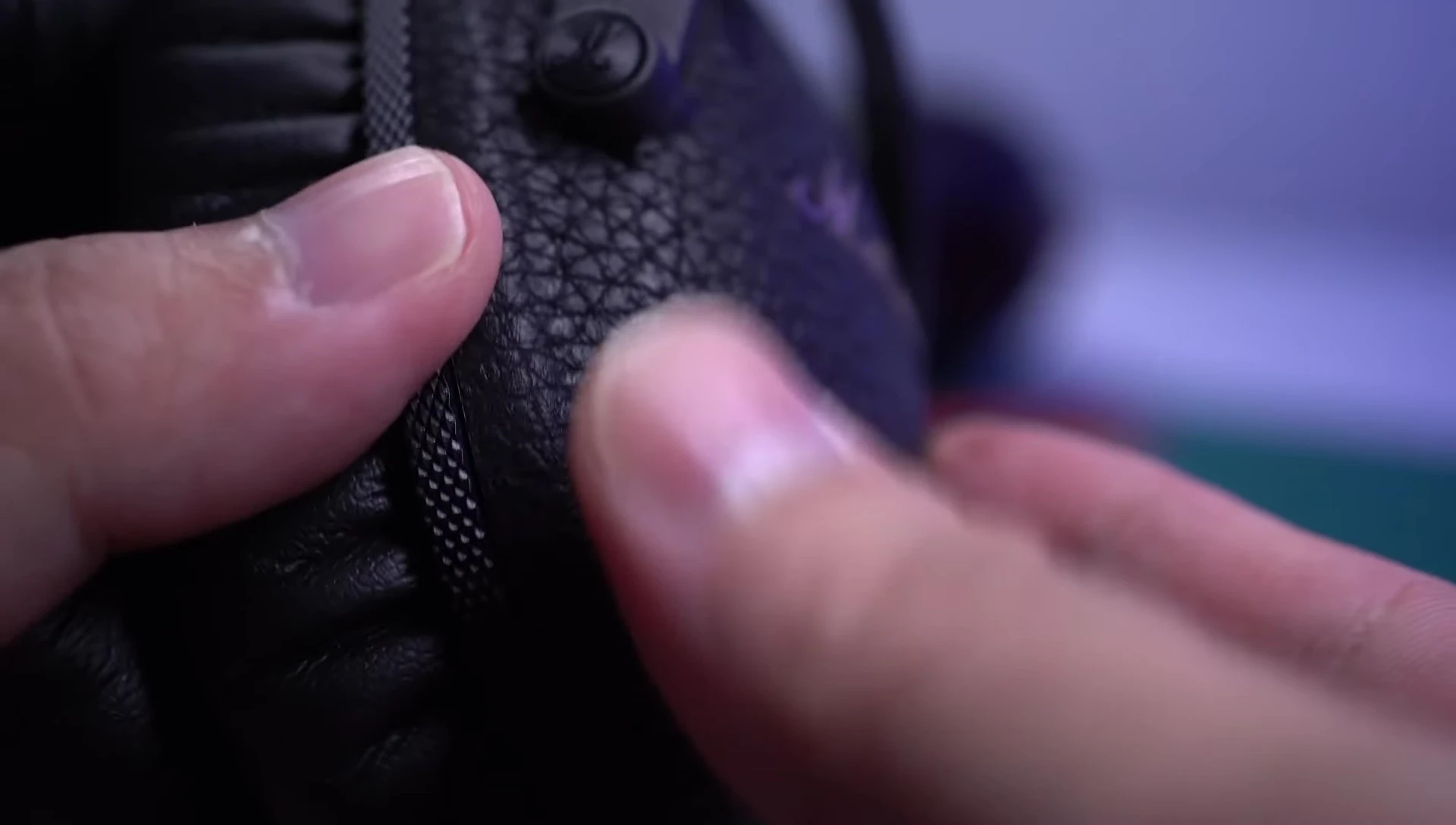 Close up of physical buttons on the headphones.