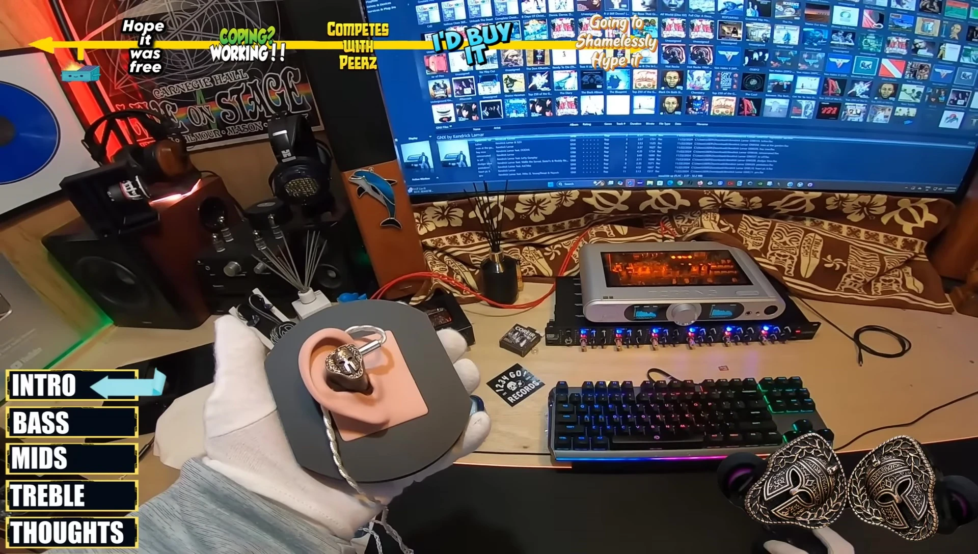 The reviewer holding the FlippEar LEGION earphones, showcasing their design.