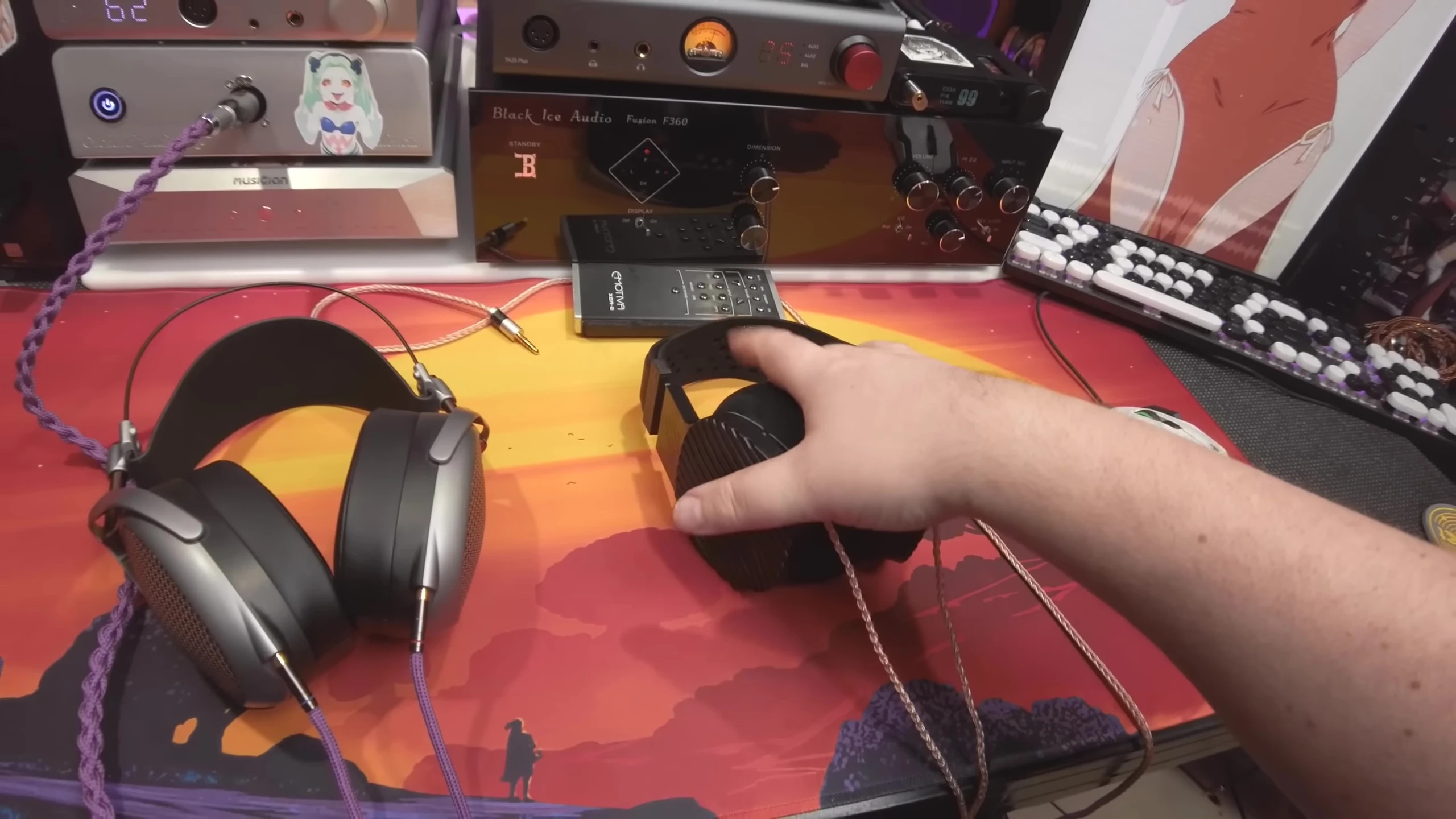 Host comparing the soundstages of both headphones