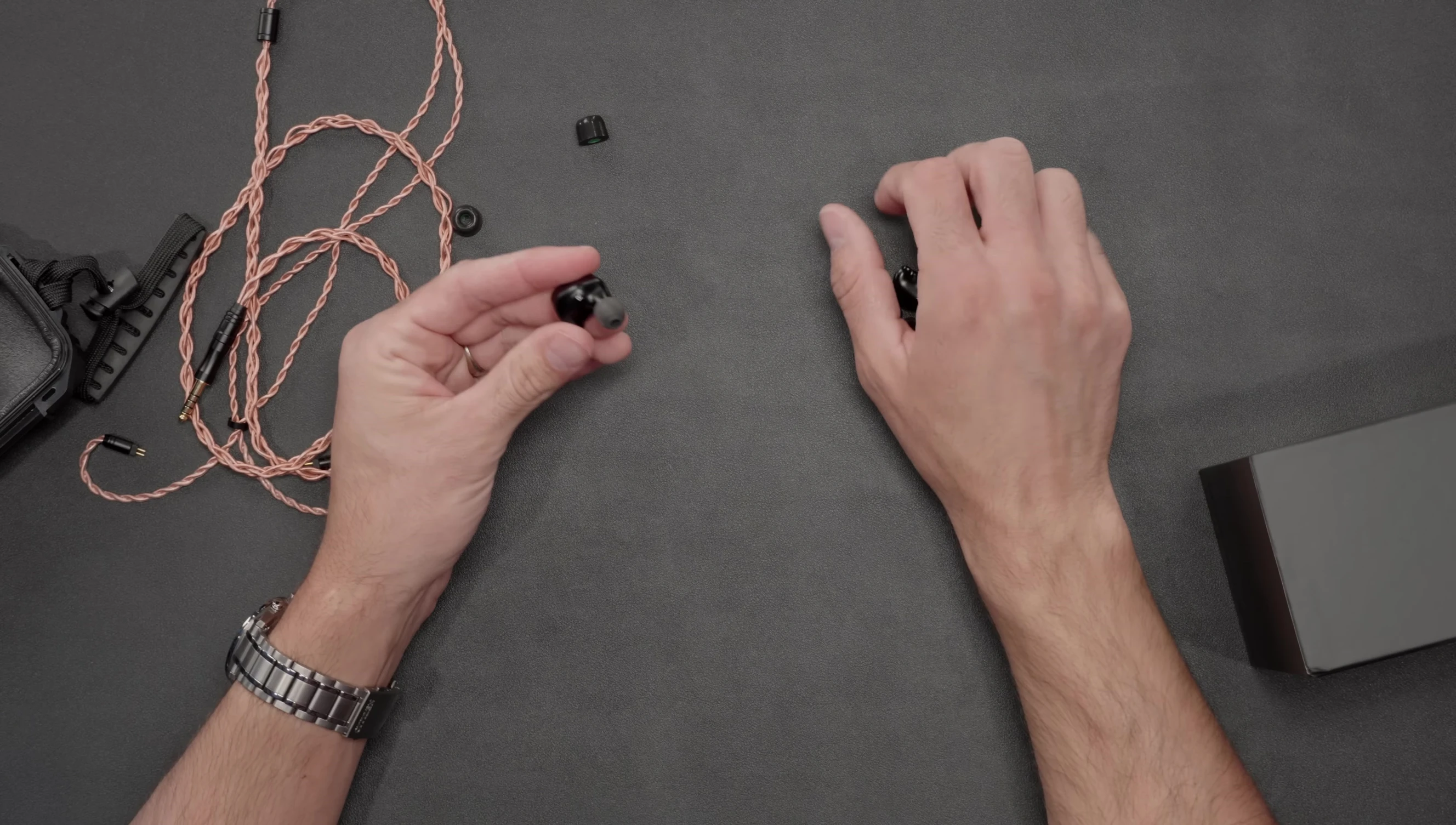 A close up of the CrinEar Meta IEMs showing its compact size.