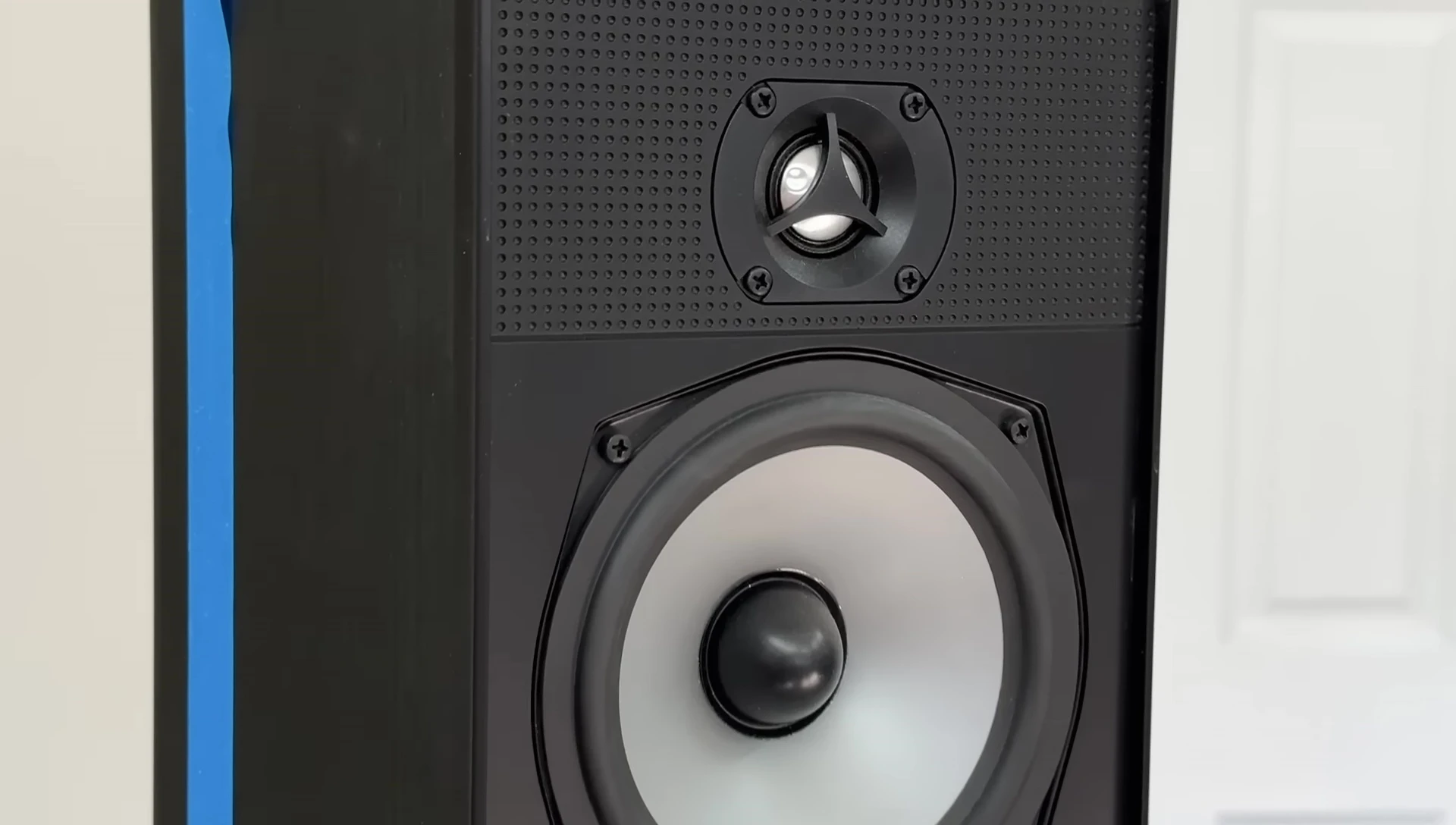 The speaker with an initial dent in the tweeter.