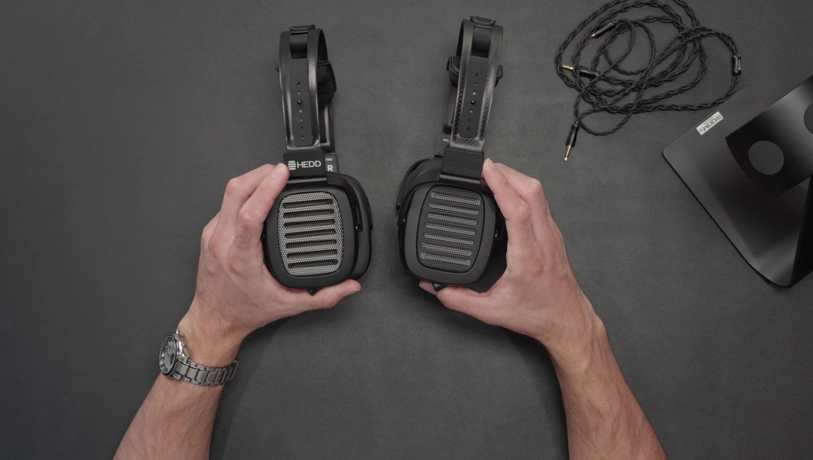 Comparison shot of the HEDDPhone 2 and 2 GT headbands, showcasing differences in finish and branding.