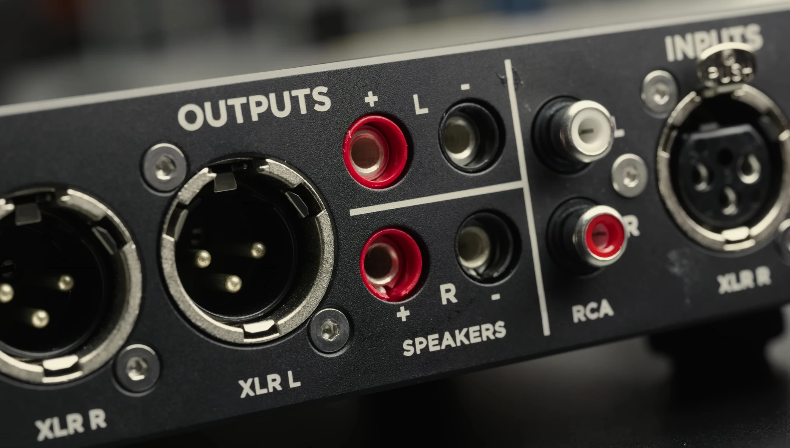View of the rear panel showing the speaker outputs and other connectivity options.