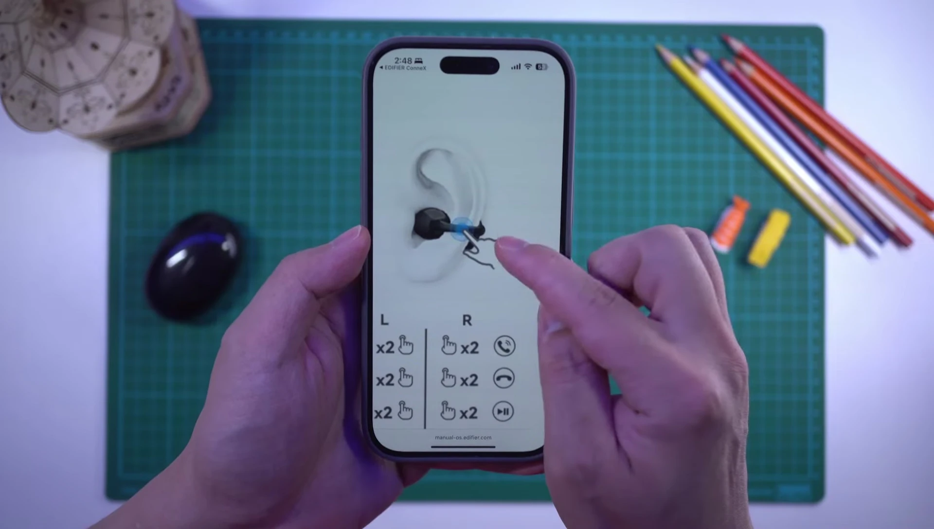 Close-up showing the touch controls on the earbuds.