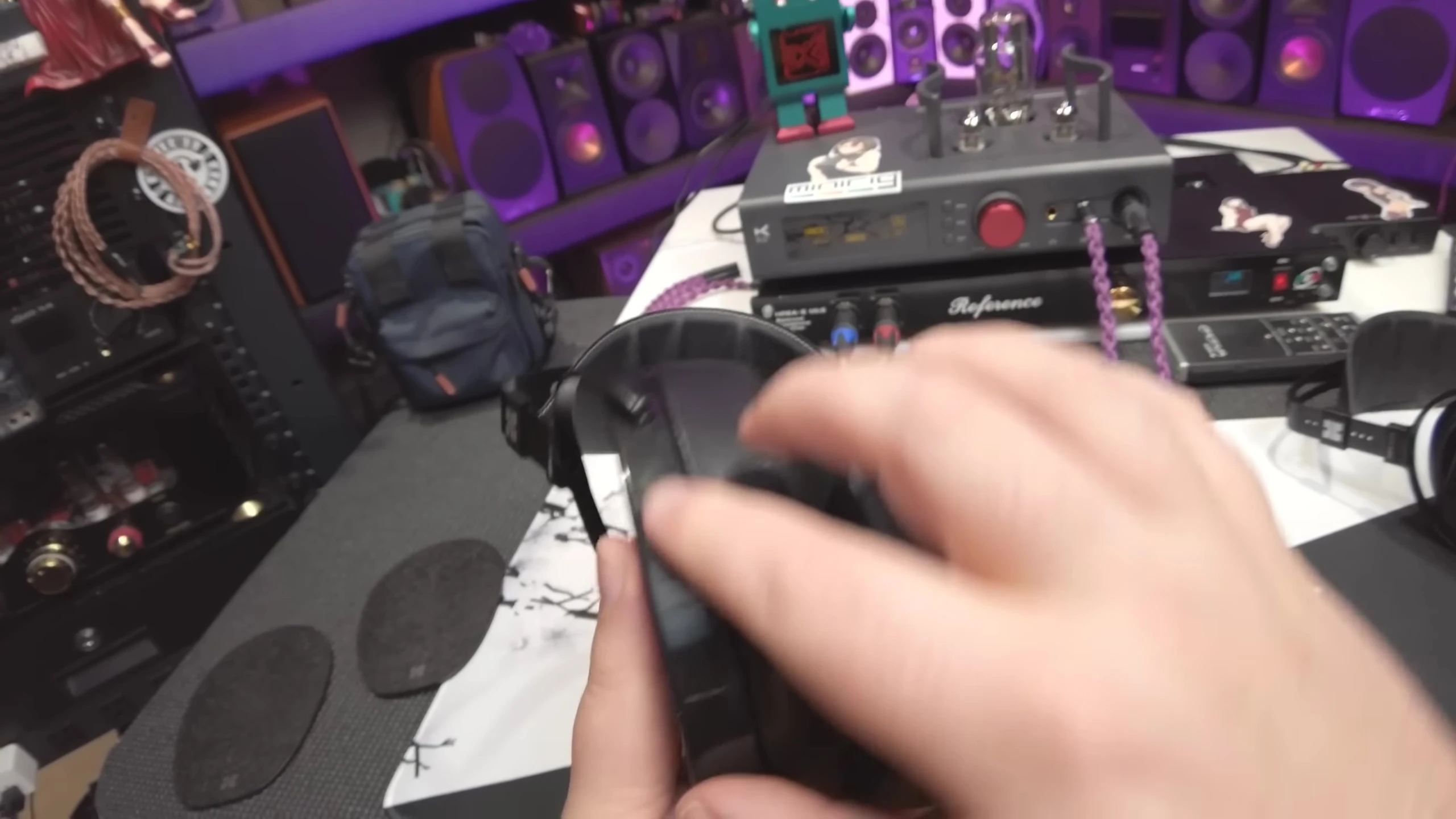 The reviewer highlighting the shiny plastic of the Arya Unveiled.