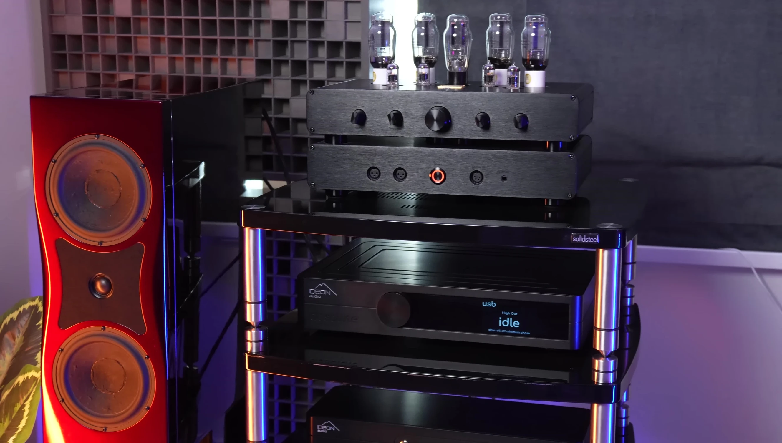 The reviewer listening to music with the TOPPING DX9.