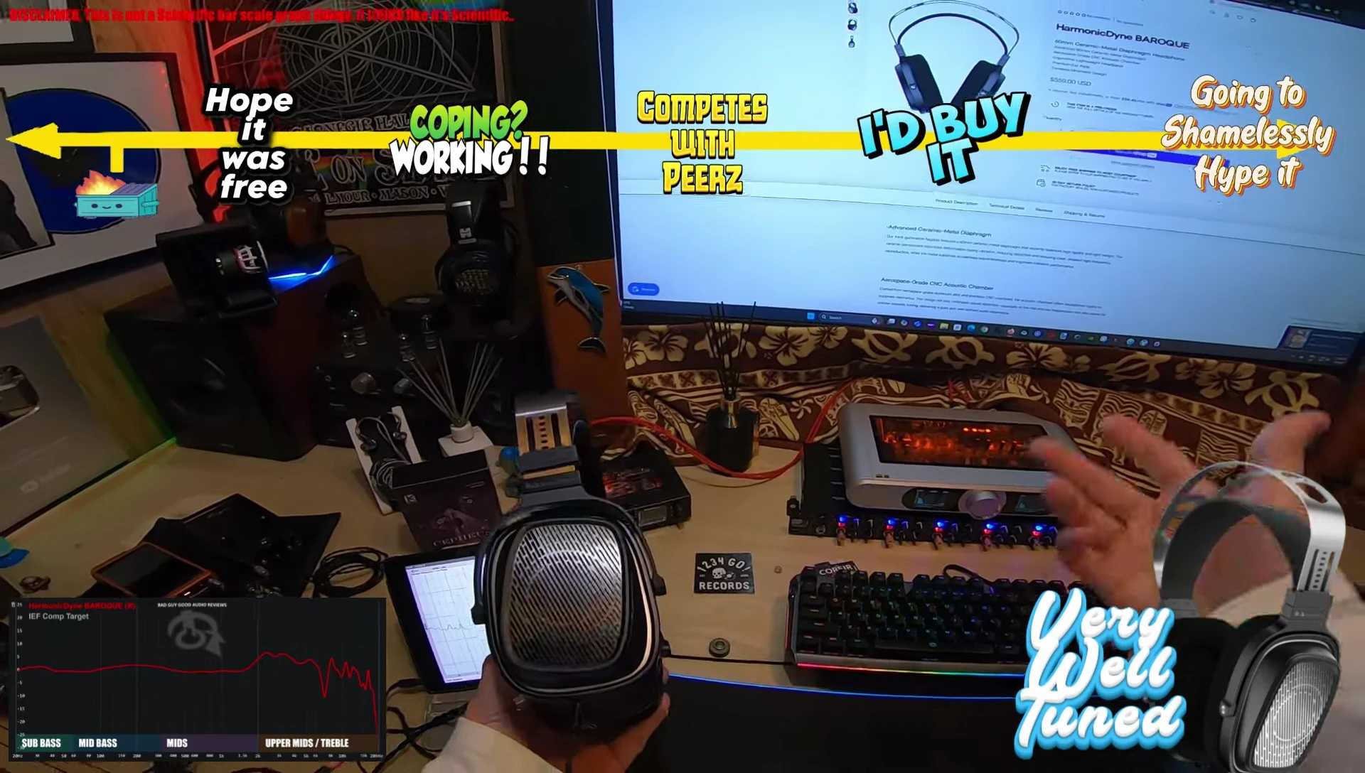 The reviewer holding the headphones