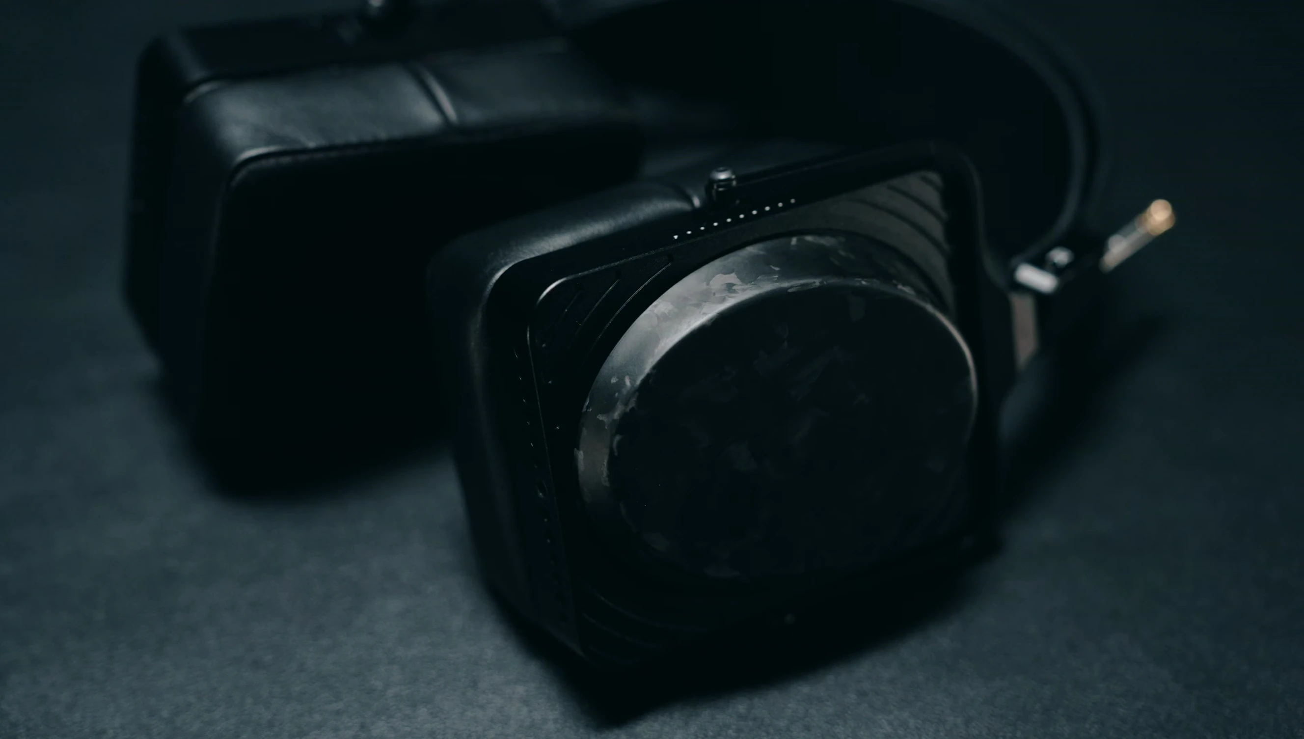 Shot showcasing the carbon fiber earcups and their satin finish.