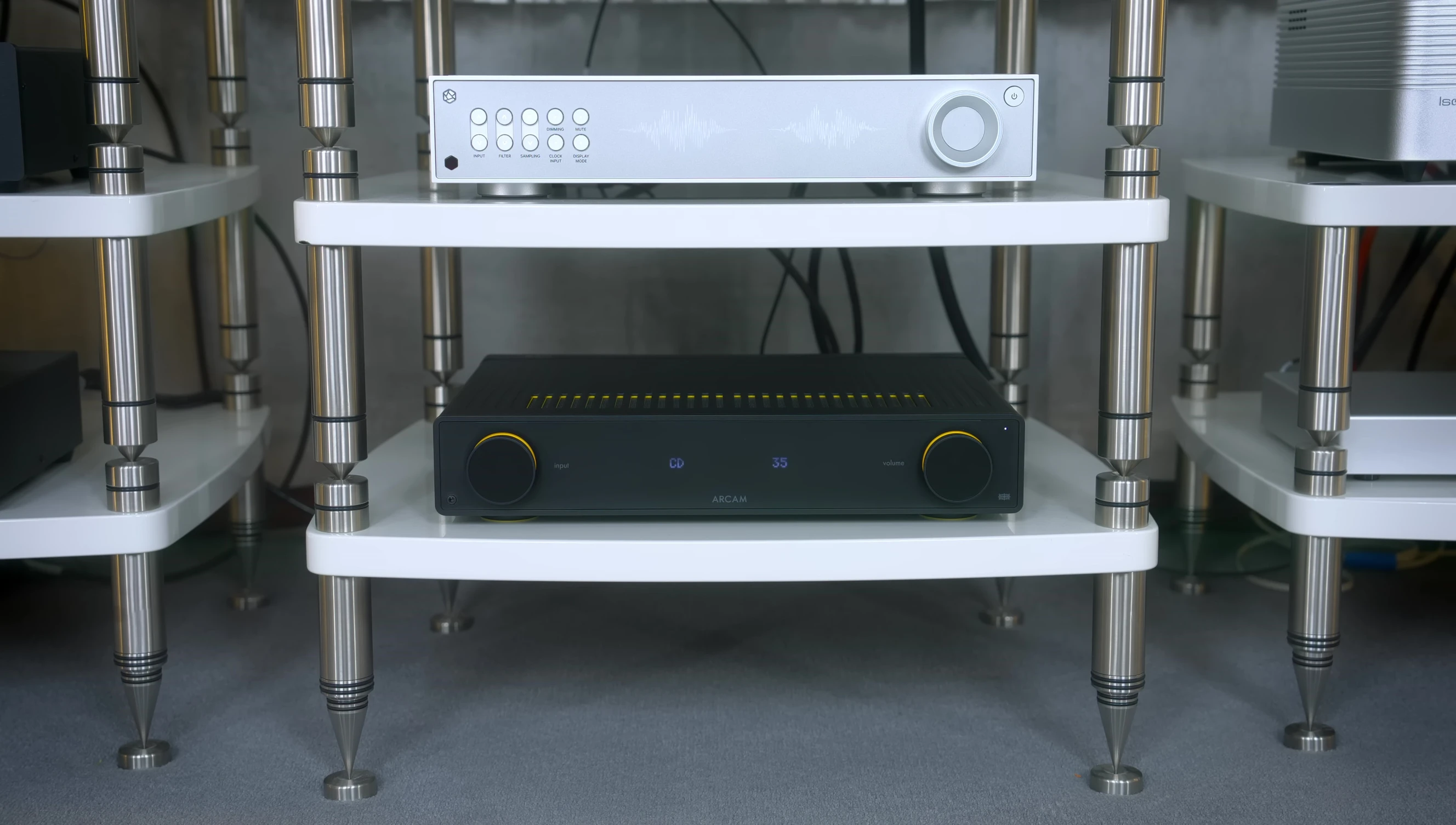 Close-up shot of the reviewer's listening setup, highlighting the speaker placement and overall aesthetic of the room.