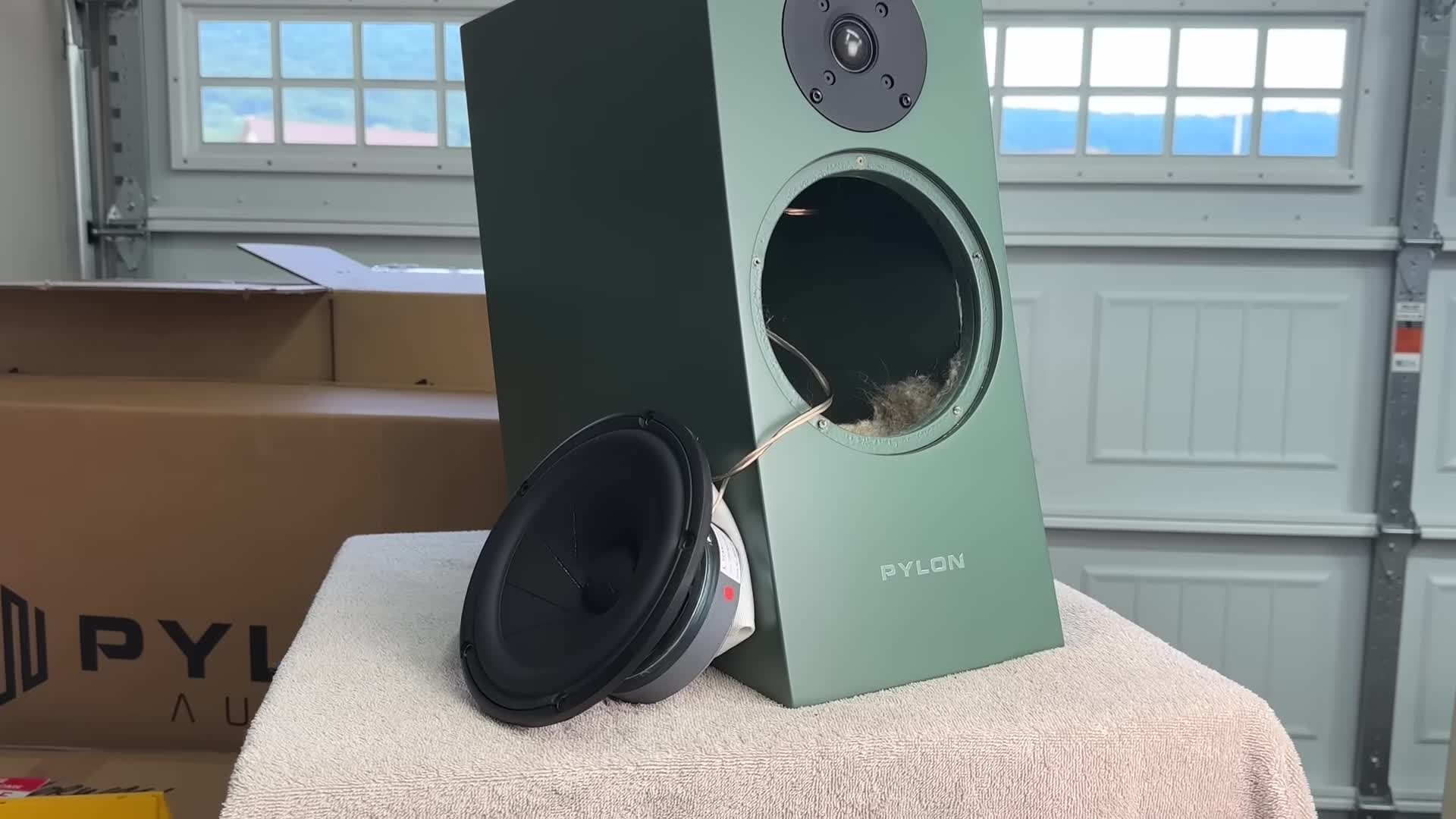 Close-up shot of the Pylon Jasper 18 speaker, highlighting its design and finish.