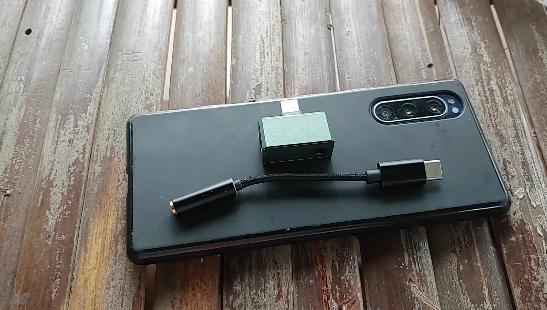 The compact size of the Celest CD2 connected to a phone