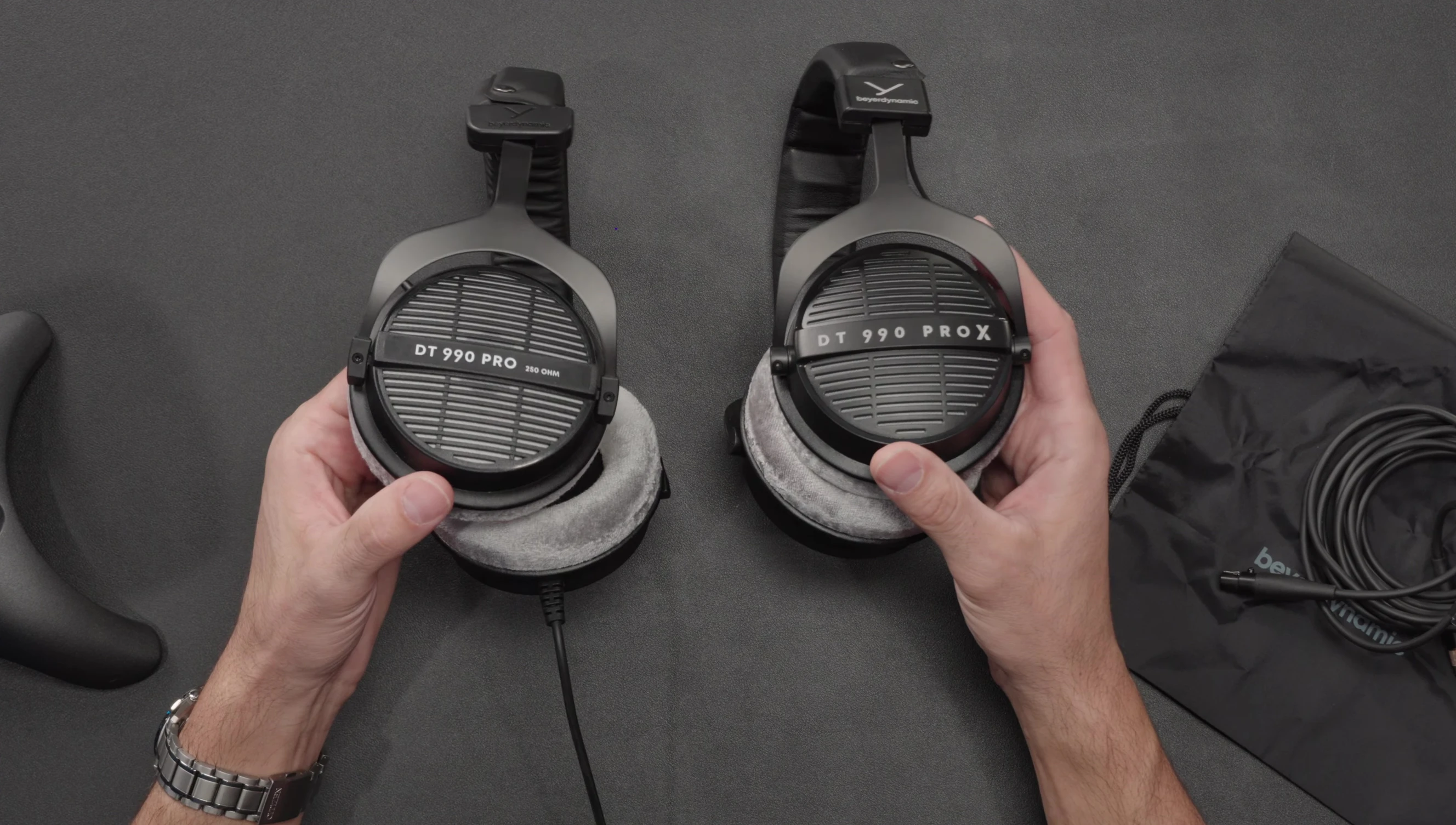Close-up showing the difference in the earcup branding between the old and new versions.