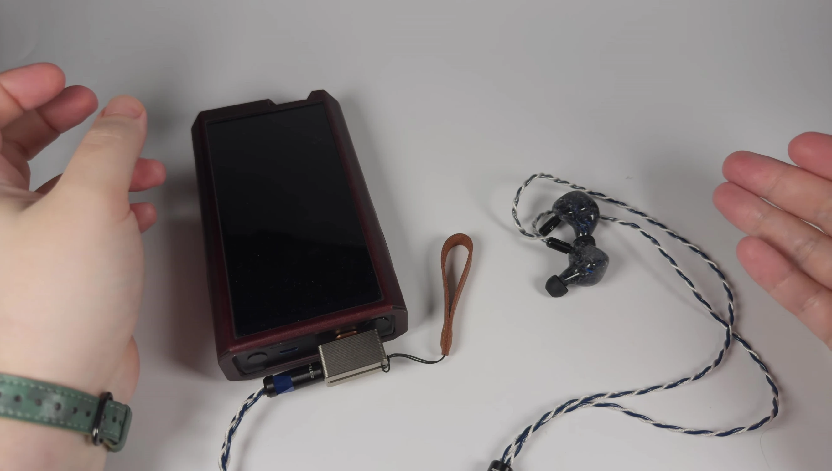 Image showing the ddHiFi Mountain 3 connected to IEMs.