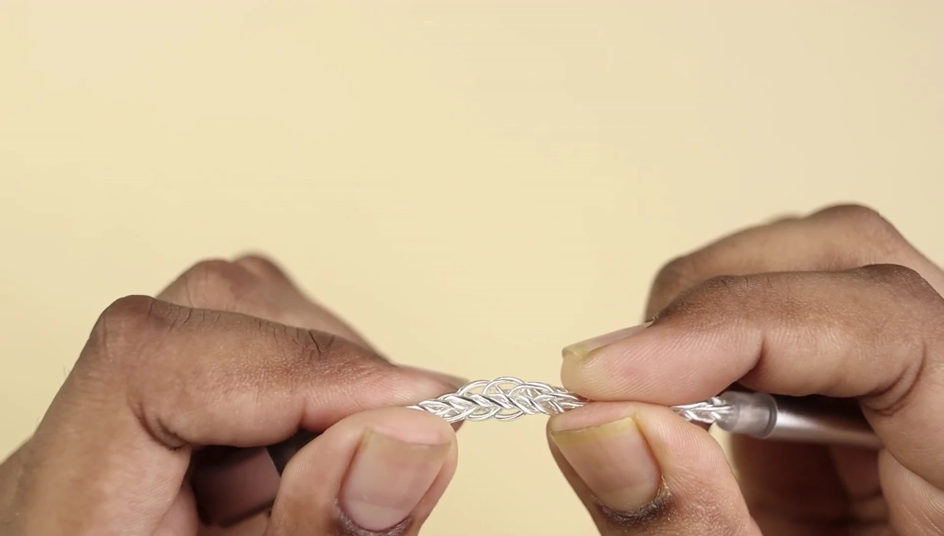 The twisted silver-plated cable