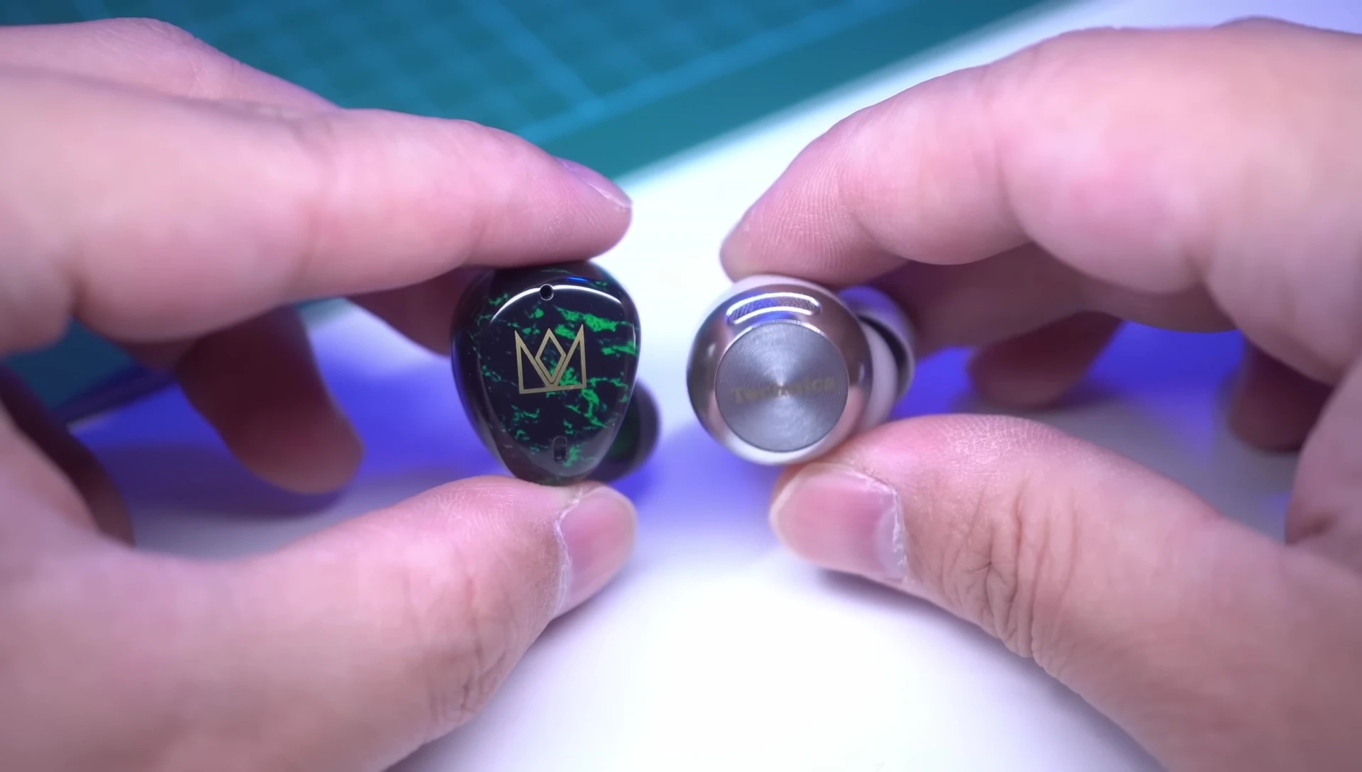 A visual representation comparing sound profiles of the three different earbuds.