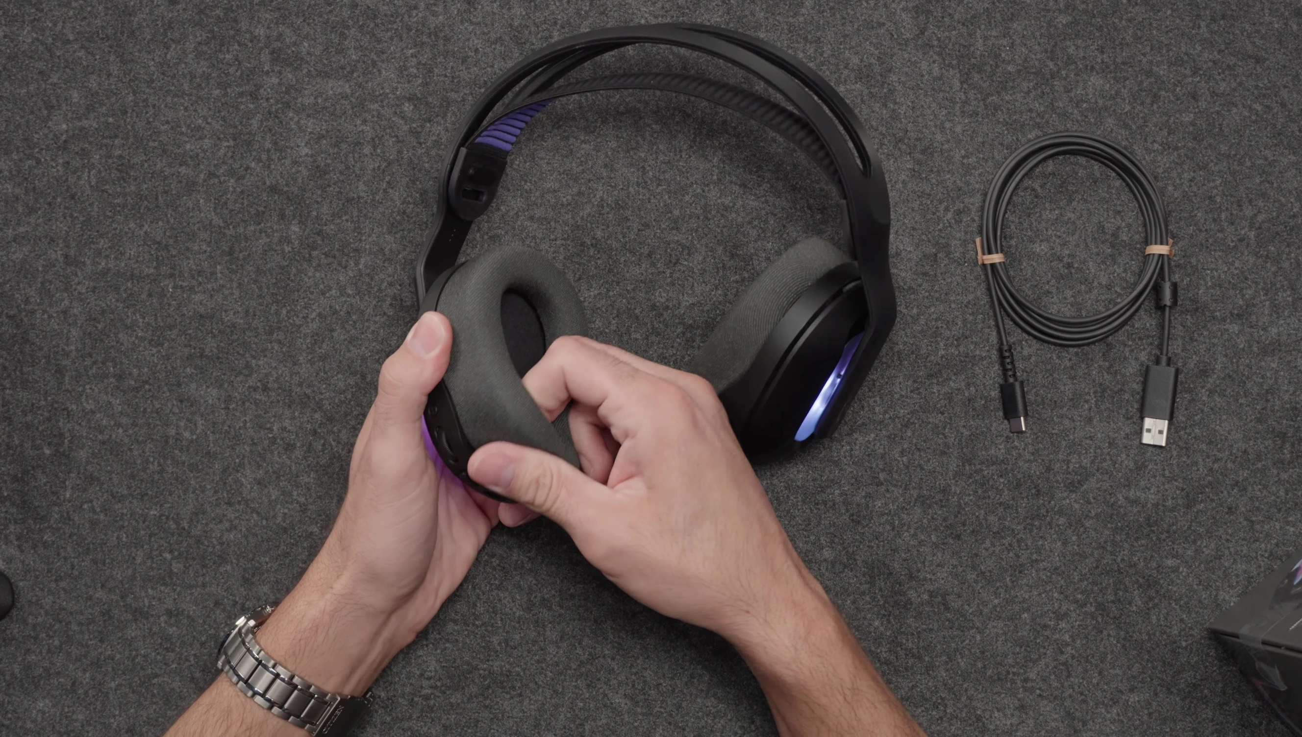 Reset pins exposed by removing the left earcup