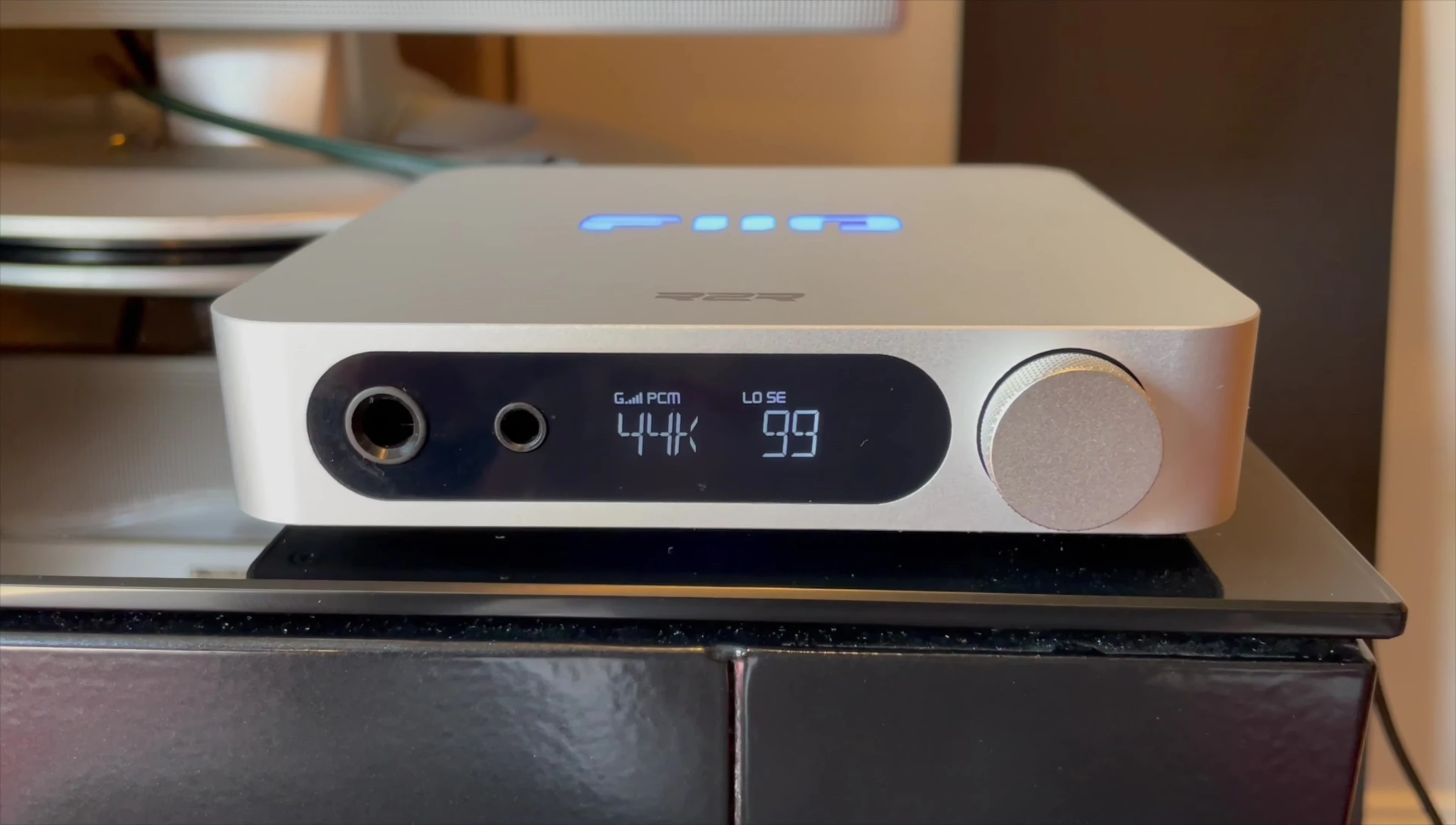 Close-up of the FiiO K11 R2R DAC/Amp highlighting the device's technical specifications.