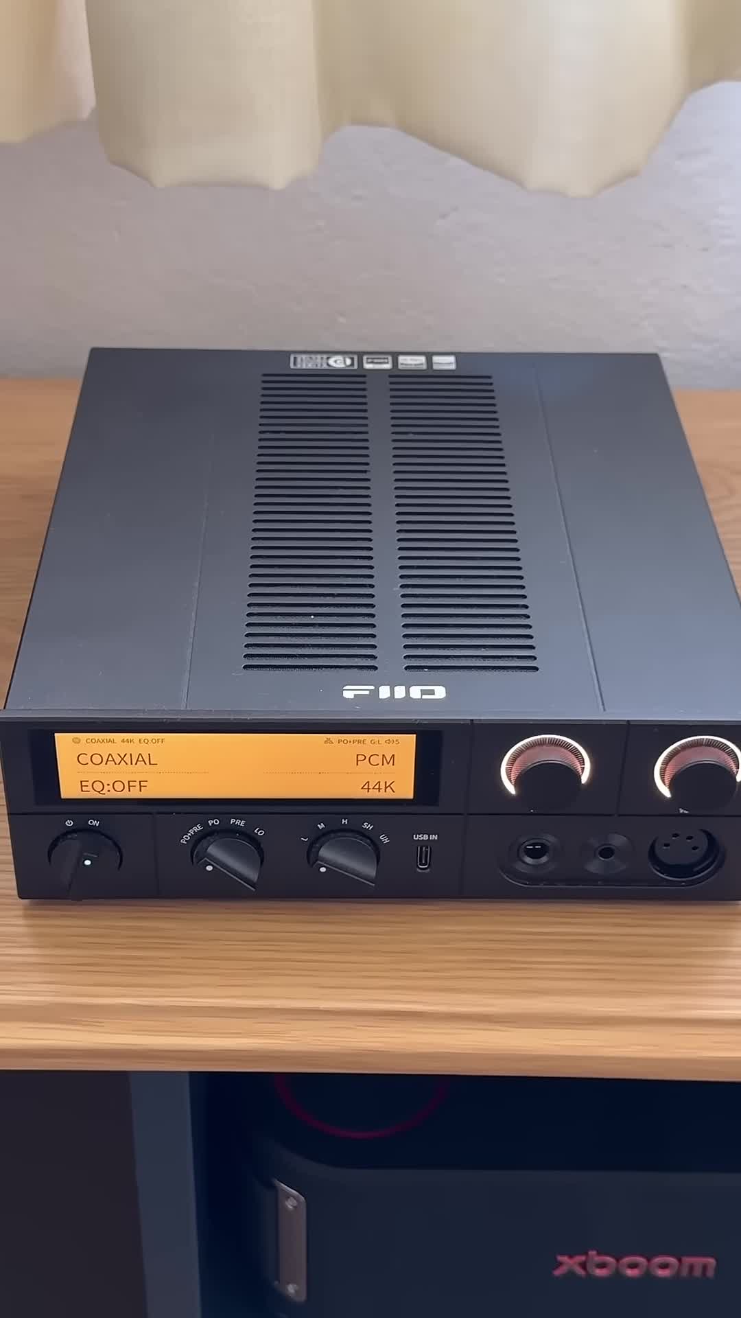 Close-up of the Fiio K17 DAC/Amplifier in its packaging.
