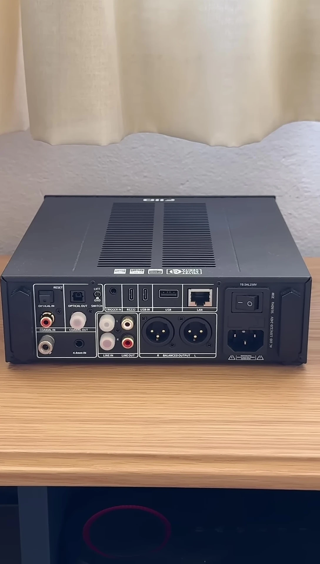 Rear panel showcasing the connectivity options: Bluetooth, Wi-Fi antennas and various inputs/outputs