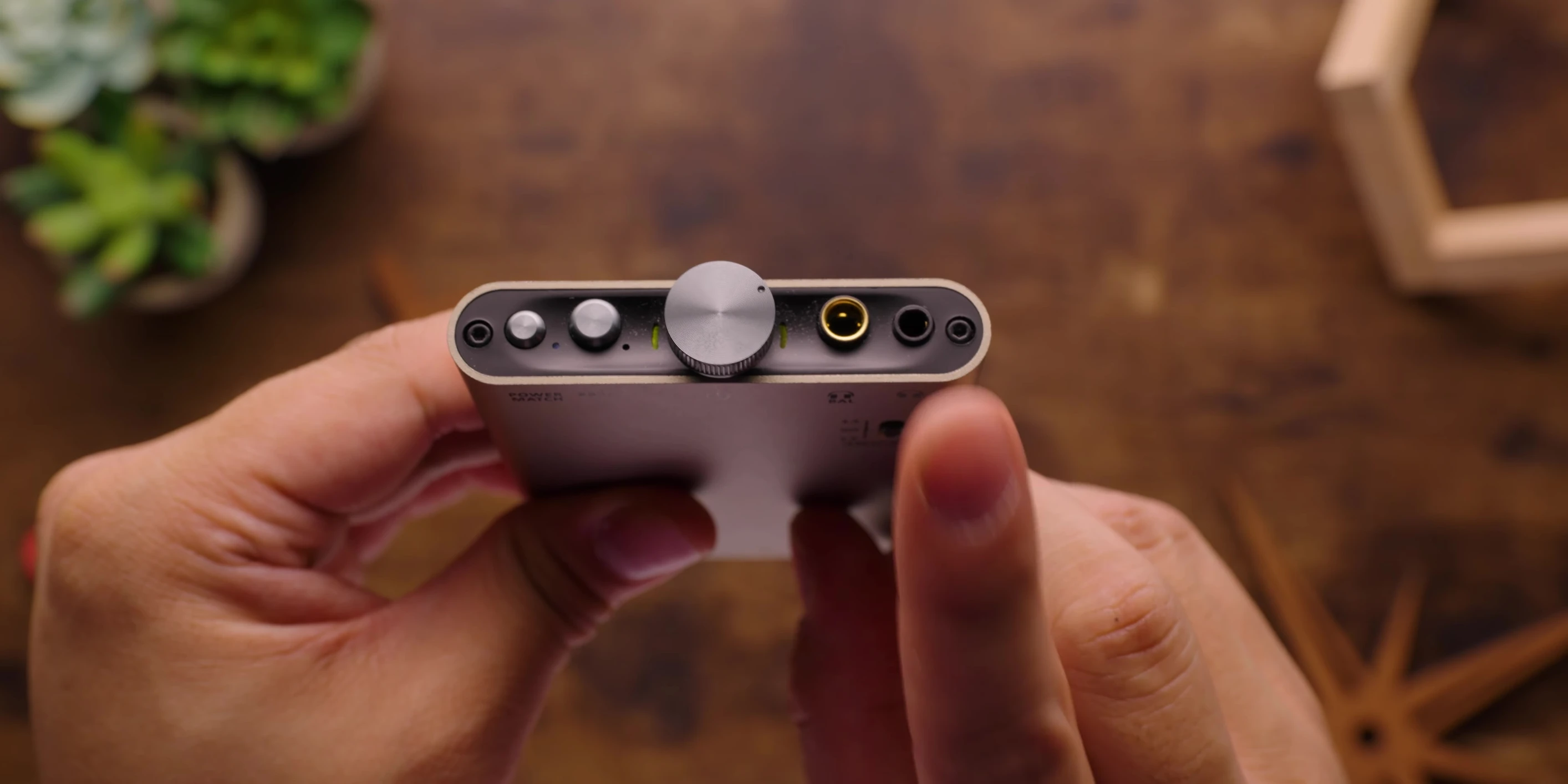 Close-up showing the 3.5mm and 4.4mm outputs of the device.