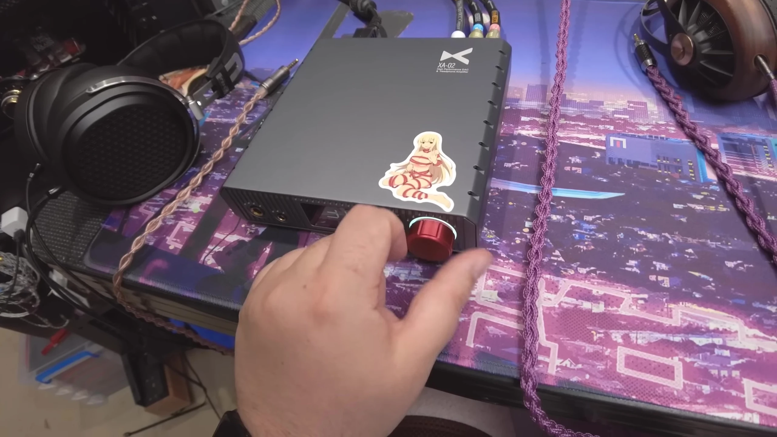 Close-up showing the volume knob and its color-changing feature