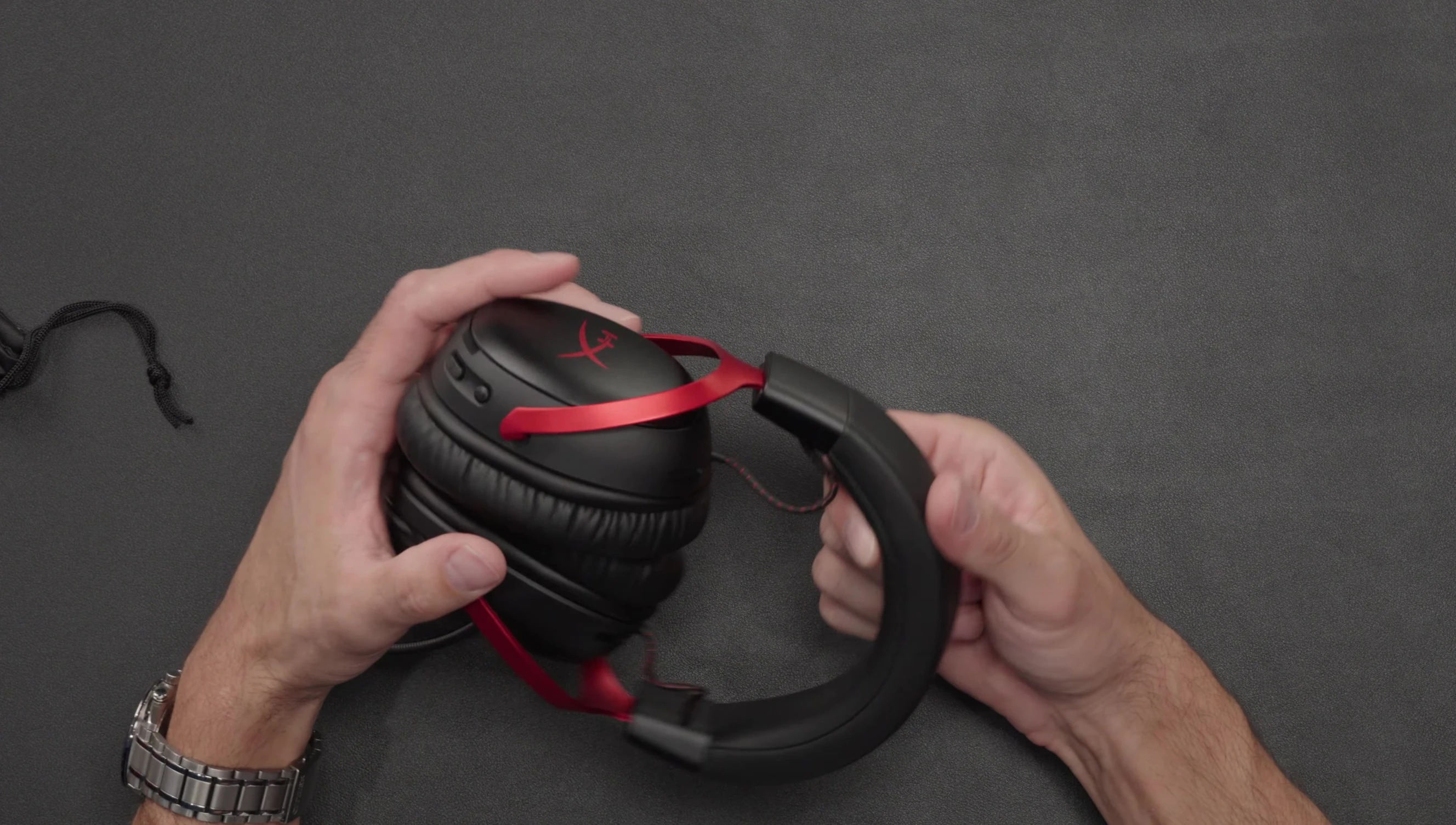 The reviewer showcasing the comfort and design of the headset.