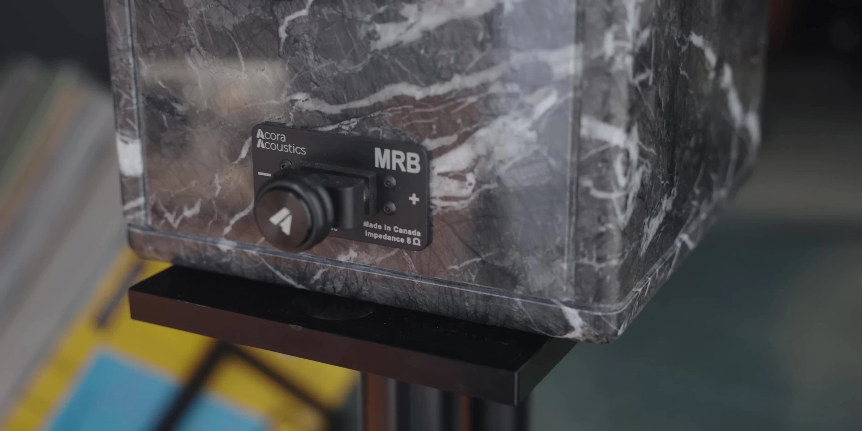 Close-up shot of a speaker showcasing its stone construction.