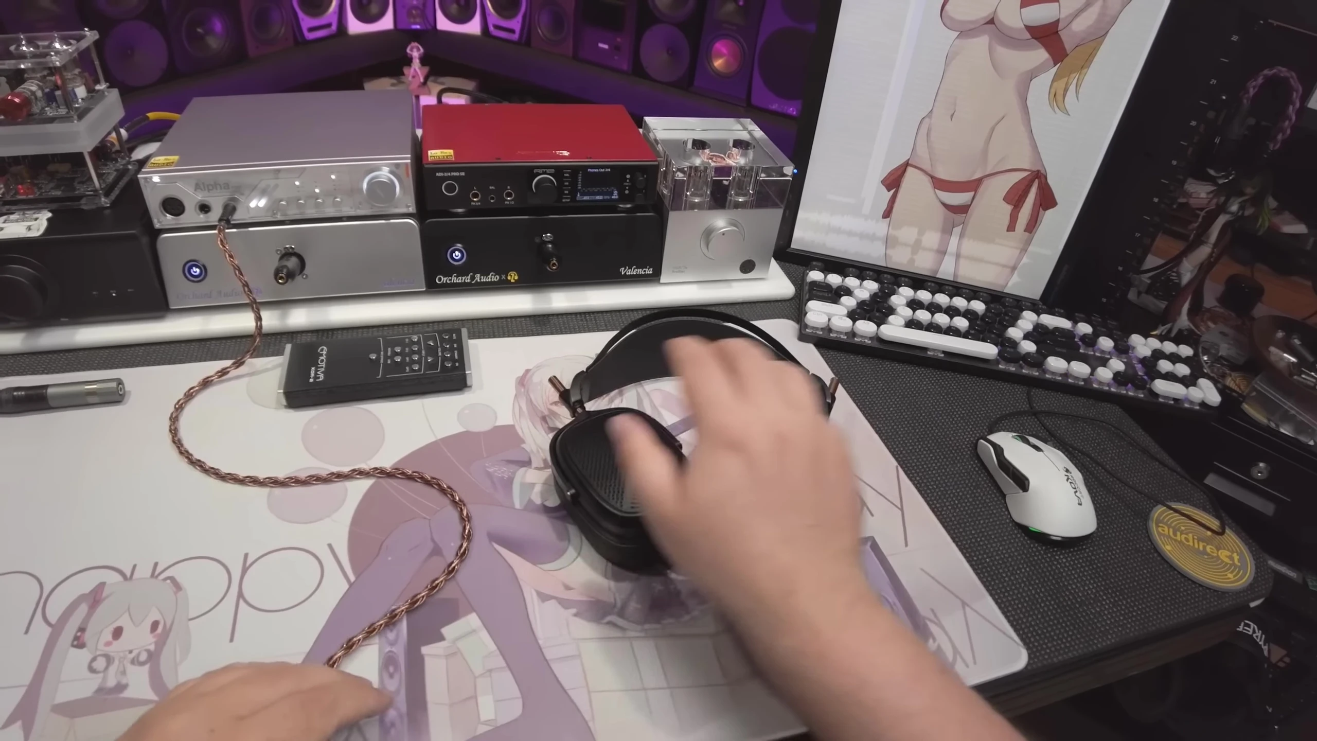The reviewer holding the headphones without packaging