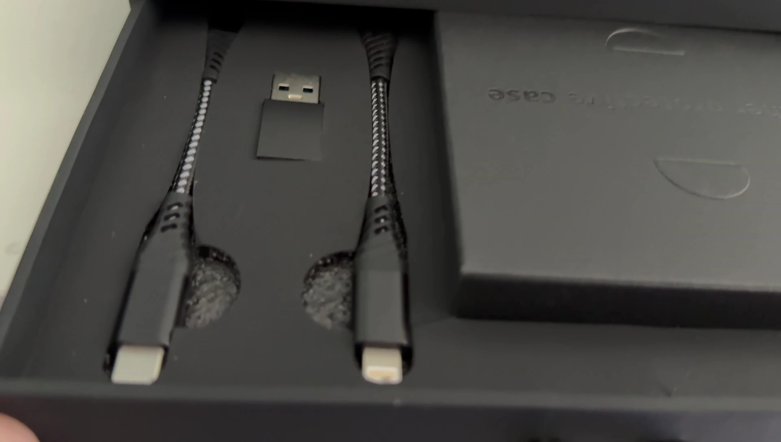 The included leather pouch and cables